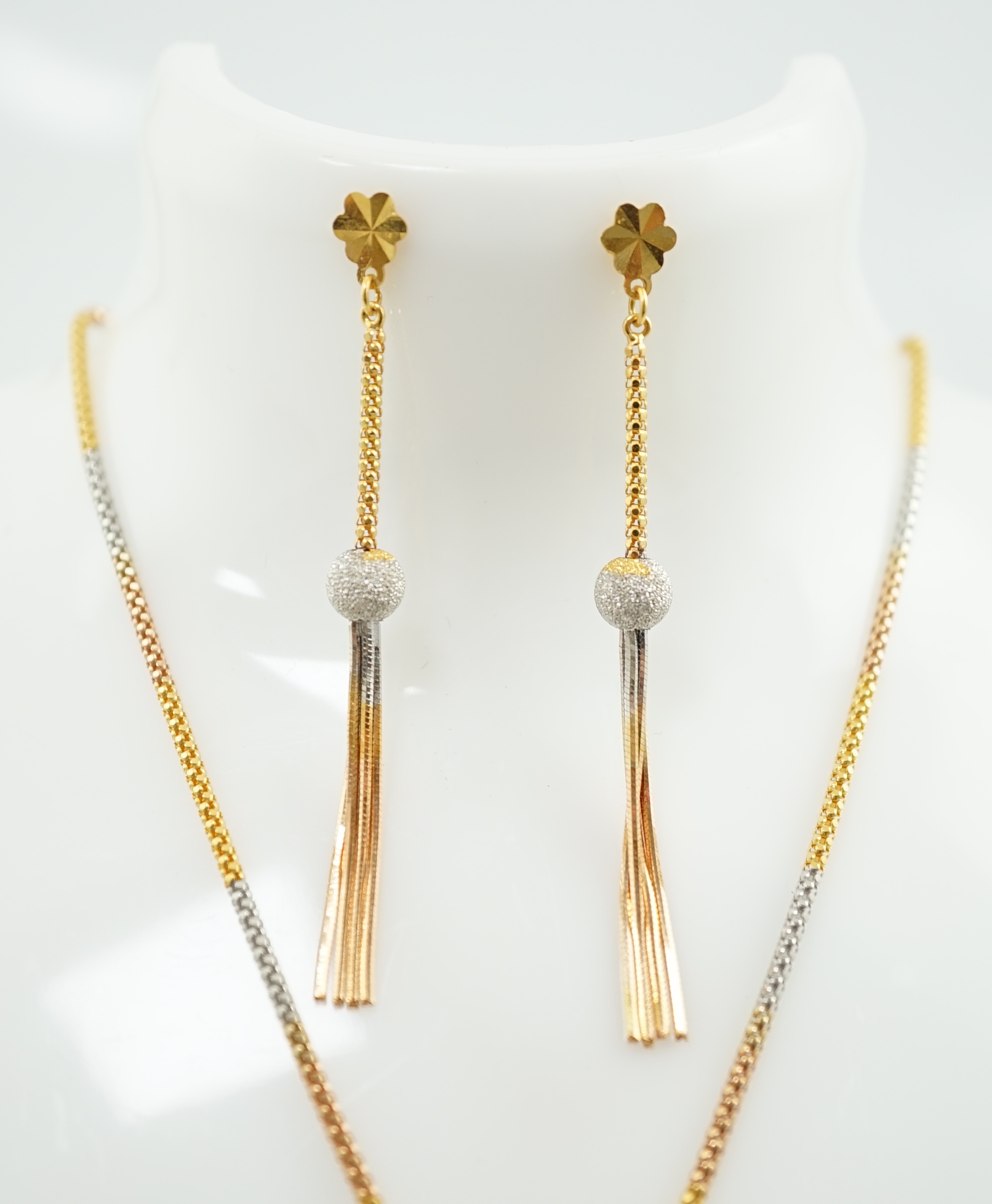 A recent Middle Eastern three colour 22k gold tassel drop necklace and pair of matching drop earrings